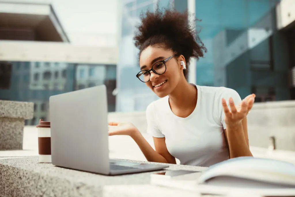 Person working at a laptop representing acceptance, reflection, and personal growth.